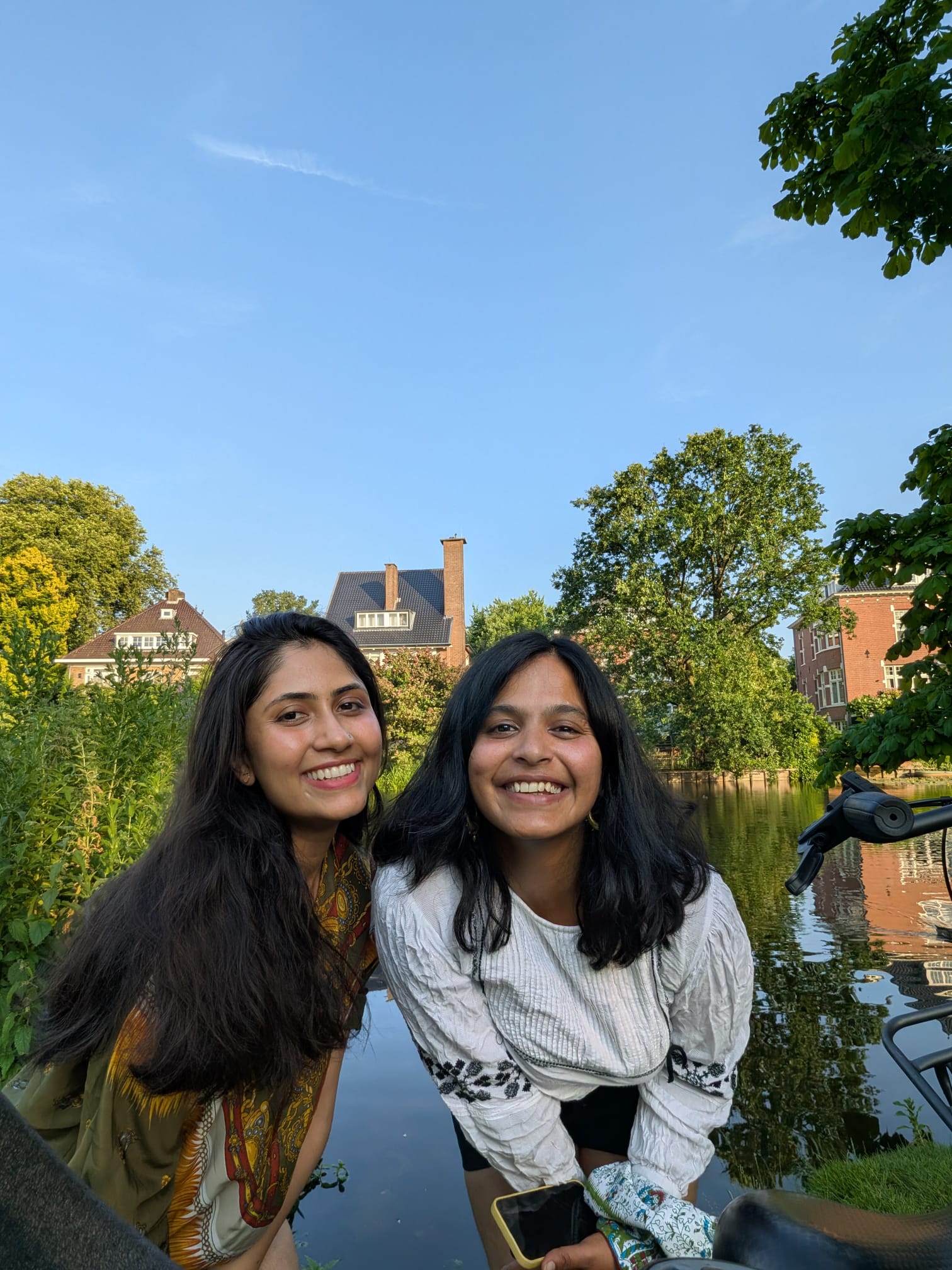 Dimple and Akkriti, founders of Ghar, by an Amsterdam canal