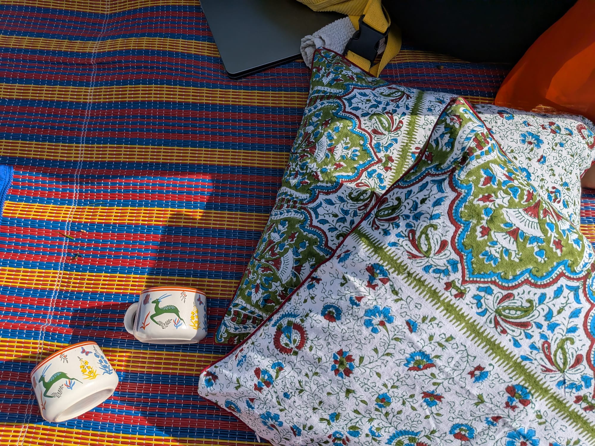 Hand block printed textiles with hand-painted ceramic cups