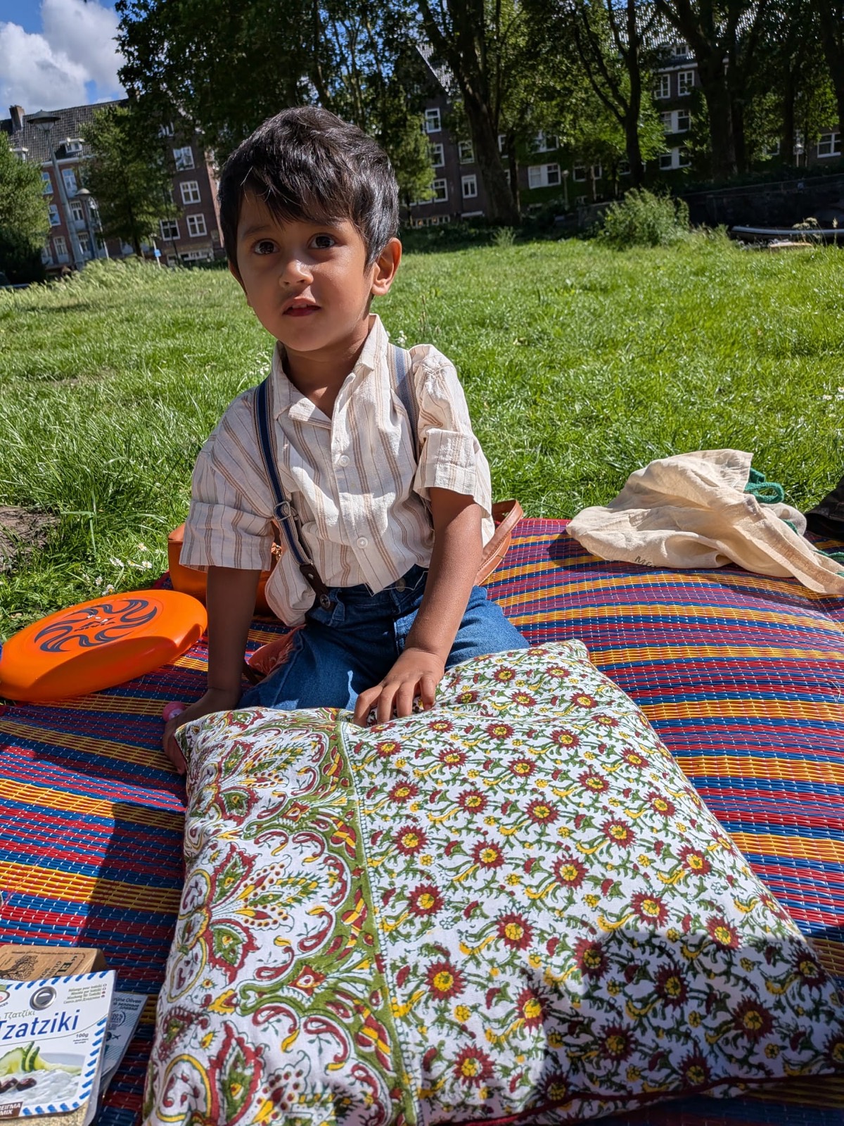 Child at a picnic with a Ghar hand block printed cushion
